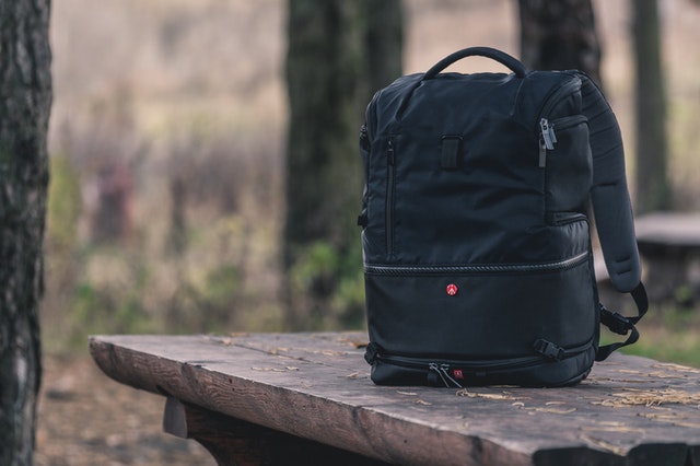 black backpack on bench