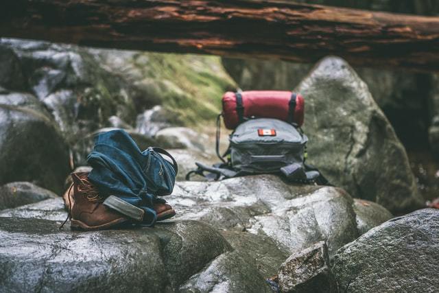 two backpacks sitting on a mountain