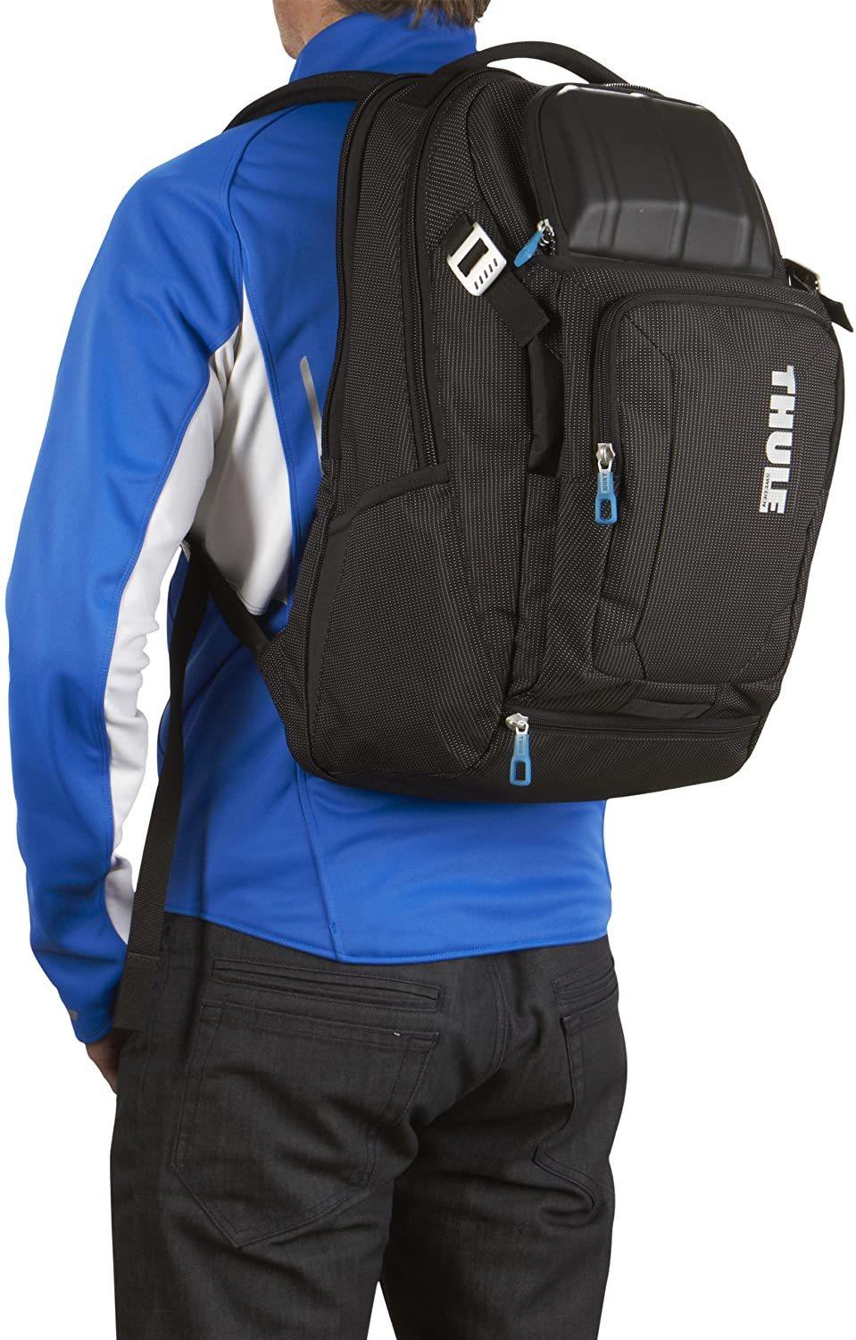 man wearing a thule crossover 32l backpack