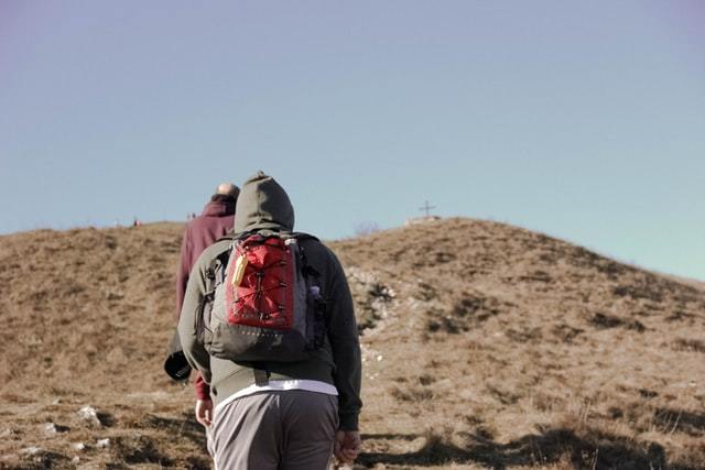 hiker wearing a north face backpack
