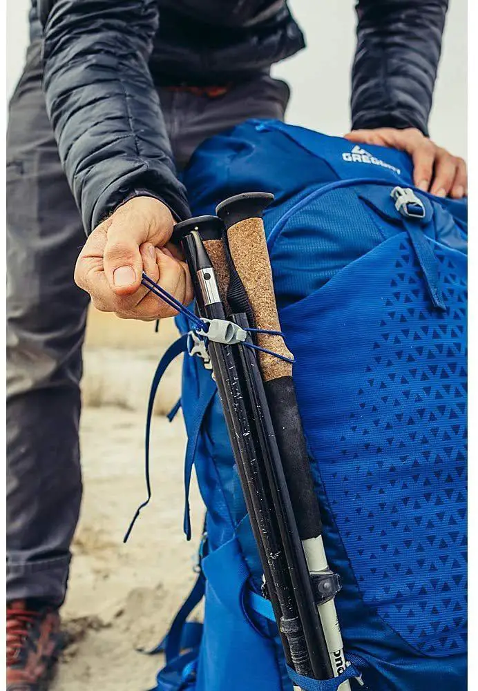 gregory backpack with trekking poles attached