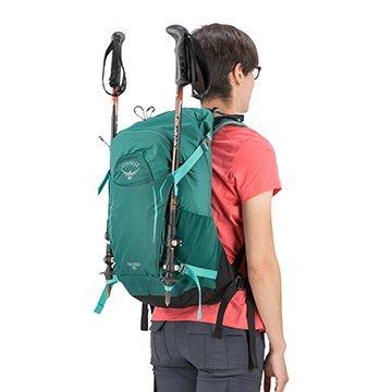 osprey backpack with trekking poles attached