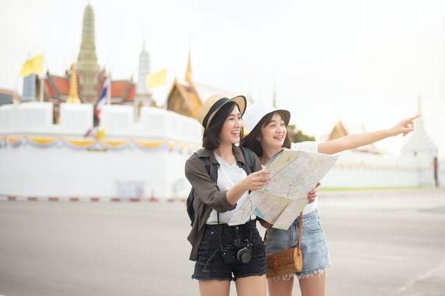 two tourists looking at a map