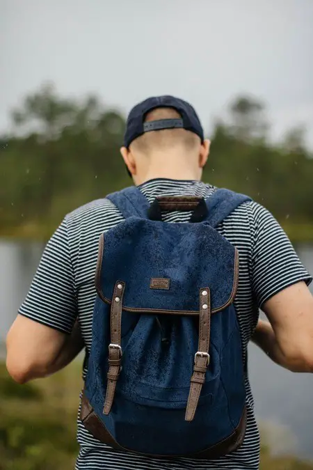 man wearing a blue backpack